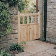 Charltons Hampton Wooden Gate with tongue and groove match boarding with vertical pales, Shown in a garden setting